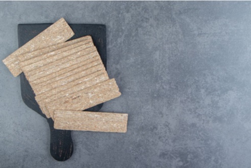 Eco-friendly fiber cement boards stacked in a UAE warehouse with green certification labels